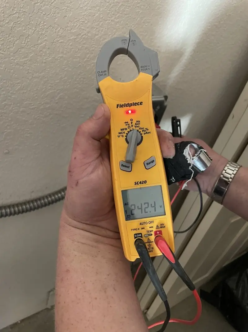 Voltage testing with clamp meter during Electrical Installation Services in Freeland